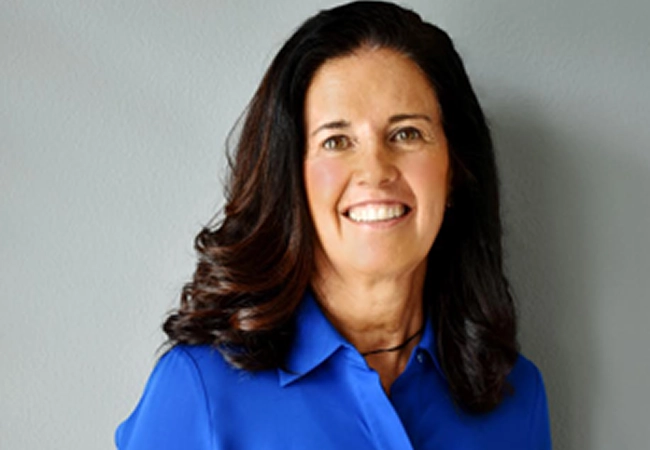 Portrait of Clara Fabre in blue blouse, conveying professionalism and leadership Clara-Fabre